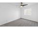 Cozy bedroom featuring a ceiling fan, soft carpet, and a window at 1743 N Dresden --, Mesa, AZ 85203