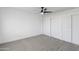 Bright bedroom featuring a ceiling fan and sliding door closet at 1743 N Dresden --, Mesa, AZ 85203