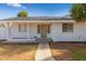 Inviting front entrance featuring a covered porch and a neutral-colored front door at 1743 N Dresden --, Mesa, AZ 85203