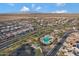 Aerial view of the community featuring an expansive community pool and green space surrounded by single-Gathering homes at 17530 W Oberlin Way, Surprise, AZ 85387