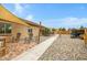 Serene backyard space featuring stone landscaping, shaded seating areas, and a private patio at 17530 W Oberlin Way, Surprise, AZ 85387