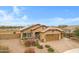 Beautiful home with a three-car garage, desert landscaping, and a charming front entry at 17530 W Oberlin Way, Surprise, AZ 85387