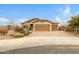 Charming single-story home with a three-car garage, desert landscaping, and a paver driveway at 17530 W Oberlin Way, Surprise, AZ 85387