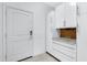 Well-organized mud room with custom cabinetry, granite countertops, and convenient storage solutions at 17530 W Oberlin Way, Surprise, AZ 85387