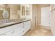 Bathroom featuring double sink vanity with granite countertops and decorative backsplash tile at 17846 W Fairview St, Goodyear, AZ 85338