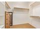 Walk-in closet with built-in shelving and ample storage space at 17846 W Fairview St, Goodyear, AZ 85338