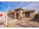 Charming single-Gathering home with stone accents, desert landscaping, and a two-car garage at 17846 W Fairview St, Goodyear, AZ 85338