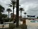 Outdoor pool with palm trees and chairs at 17846 W Fairview St, Goodyear, AZ 85338