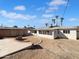 Large backyard with a covered patio, a firepit, and a detached garage at 1801 W 5Th Pl, Mesa, AZ 85201