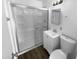 Clean bathroom featuring a shower with sliding doors, a modern vanity, and a toilet, offering a functional space at 1801 W 5Th Pl, Mesa, AZ 85201