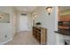 Inviting entryway with tile flooring, decorative sconces, and a wooden console table at 18701 N Diamond Dr, Surprise, AZ 85374