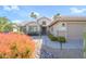 Inviting home with a walkway lined with garden lights, desert landscaping and a covered front porch at 18701 N Diamond Dr, Surprise, AZ 85374