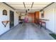 Spacious garage with finished walls, workbench, custom built-in cabinets, and space for parking and hobbies at 18701 N Diamond Dr, Surprise, AZ 85374