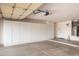 Clean garage with smooth concrete floors, wall to wall built-in storage cabinets, providing plenty of organized space at 18701 N Diamond Dr, Surprise, AZ 85374