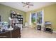 Home office with neutral walls, a large window, and a ceiling fan at 18701 N Diamond Dr, Surprise, AZ 85374