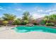 Backyard pool with desert landscaping and a waterfall feature at 18701 N Diamond Dr, Surprise, AZ 85374