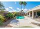 Backyard pool featuring desert landscaping, and mature palm trees at 18701 N Diamond Dr, Surprise, AZ 85374