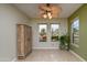 Bright sitting room with dual windows overlooking the landscaped front yard at 18701 N Diamond Dr, Surprise, AZ 85374