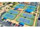 Aerial view showcases several community tennis courts and surrounding parking at 1873 Leisure World --, Mesa, AZ 85206