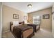 Comfortable bedroom featuring twin beds with leopard print blankets and ample natural light from the window at 1873 Leisure World --, Mesa, AZ 85206