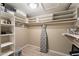 Walk-in closet with custom shelving to maximize storage at 1873 Leisure World --, Mesa, AZ 85206