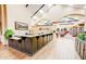 Community library showcasing a reception desk, high ceilings, and open access to the book collections and seating areas at 1873 Leisure World --, Mesa, AZ 85206