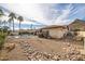 Backyard featuring desert landscaping with a pool, lounge seating, and mountain views at 1908 E Beck Ln, Phoenix, AZ 85022