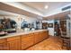 Eat-in kitchen featuring a large island, custom counter, and terracotta tile flooring at 1908 E Beck Ln, Phoenix, AZ 85022