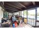 Relaxing patio with wicker furniture overlooking the pool area and backyard at 1908 E Beck Ln, Phoenix, AZ 85022