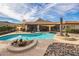 A backyard pool with desert landscaping, lounge seating, and partial mountain views at 1908 E Beck Ln, Phoenix, AZ 85022