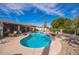 Inviting pool in backyard oasis with lush landscaping, perfect for relaxation and entertaining at 1908 E Beck Ln, Phoenix, AZ 85022