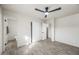 Bedroom with sliding closet, en-suite bathroom, and wood-look flooring at 1911 W Kimberly Way, Phoenix, AZ 85027