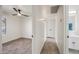 Hallway provides access to a bathroom and bedroom with wood-look floors at 1911 W Kimberly Way, Phoenix, AZ 85027