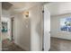 Hallway with wood-look floors, white trim, and a view to the exterior at 1911 W Kimberly Way, Phoenix, AZ 85027