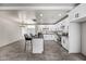 Modern kitchen with white cabinetry, stainless steel appliances, and a breakfast bar at 1911 W Kimberly Way, Phoenix, AZ 85027