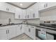 White cabinets, stainless steel oven and dark countertops give this kitchen a sleek modern look at 1911 W Kimberly Way, Phoenix, AZ 85027