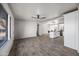 Bright living area with wood-look floors, seamlessly connecting to the modern kitchen at 1911 W Kimberly Way, Phoenix, AZ 85027