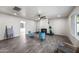 Modern living room showcasing tile floors, a fireplace, and ample natural light at 1911 W Kimberly Way, Phoenix, AZ 85027