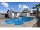 View of the refreshing in-ground pool with solar panels on the roof of the house at 1911 W Kimberly Way, Phoenix, AZ 85027