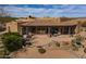 An aerial view showcases the home's patio, landscaping, and architecture at 19131 E Tonto Verde Dr, Rio Verde, AZ 85263