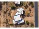 Top-down aerial view of a home showing the driveway, neutral desert landscaping and unique roof design at 19131 E Tonto Verde Dr, Rio Verde, AZ 85263