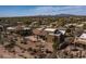 Aerial view of a southwestern home featuring a rear patio and desert landscaping, all fenced in at 19131 E Tonto Verde Dr, Rio Verde, AZ 85263