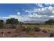 Expansive backyard view overlooking the golf course with desert landscaping and mountain views at 19131 E Tonto Verde Dr, Rio Verde, AZ 85263