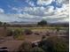 Scenic backyard view showcasing lush landscaping, a manicured golf course, and stunning mountain backdrop at 19131 E Tonto Verde Dr, Rio Verde, AZ 85263