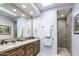 Bathroom featuring a double vanity with granite countertops and a tiled walk-in shower at 19131 E Tonto Verde Dr, Rio Verde, AZ 85263