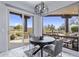 Breakfast nook features views of desert landscaping and backyard patio with a table set for four at 19131 E Tonto Verde Dr, Rio Verde, AZ 85263