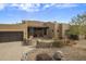 Inviting desert home with a private courtyard, gated entry and decorative plants at 19131 E Tonto Verde Dr, Rio Verde, AZ 85263