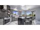 Modern kitchen offers stylish black and gray cabinets, marble floors, and stunning desert landscape views at 19131 E Tonto Verde Dr, Rio Verde, AZ 85263