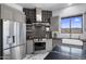 Well-appointed kitchen showcases stainless appliances, gray cabinetry, stylish tile and desert mountain views at 19131 E Tonto Verde Dr, Rio Verde, AZ 85263