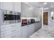 Gourmet kitchen featuring gray cabinetry, stainless steel appliances, and black countertops at 19131 E Tonto Verde Dr, Rio Verde, AZ 85263